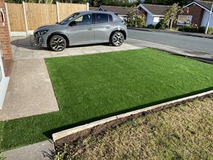 Artificial grass front lawn with paved path