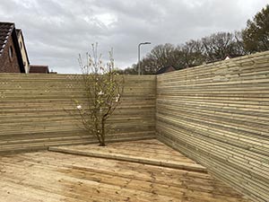 Timber decking area with matching batten fencing
