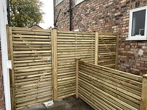 Batten style garden fencing with matching timber gates