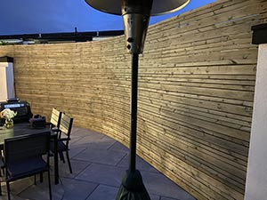 Batten fencing fitted to an existing garden wall