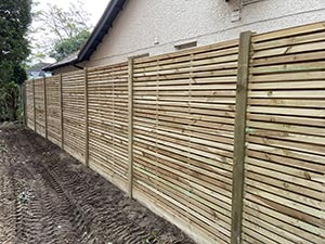 Forest style slatted fence panels with matching posts