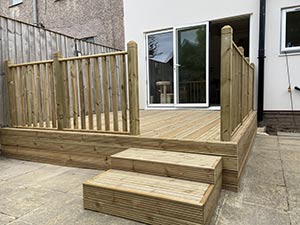 Raised timber decking in a rear garden